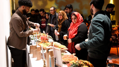 People assemble for an iftar meal