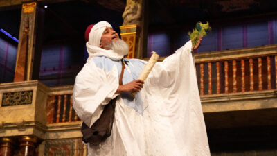 An actor performs on a stage.