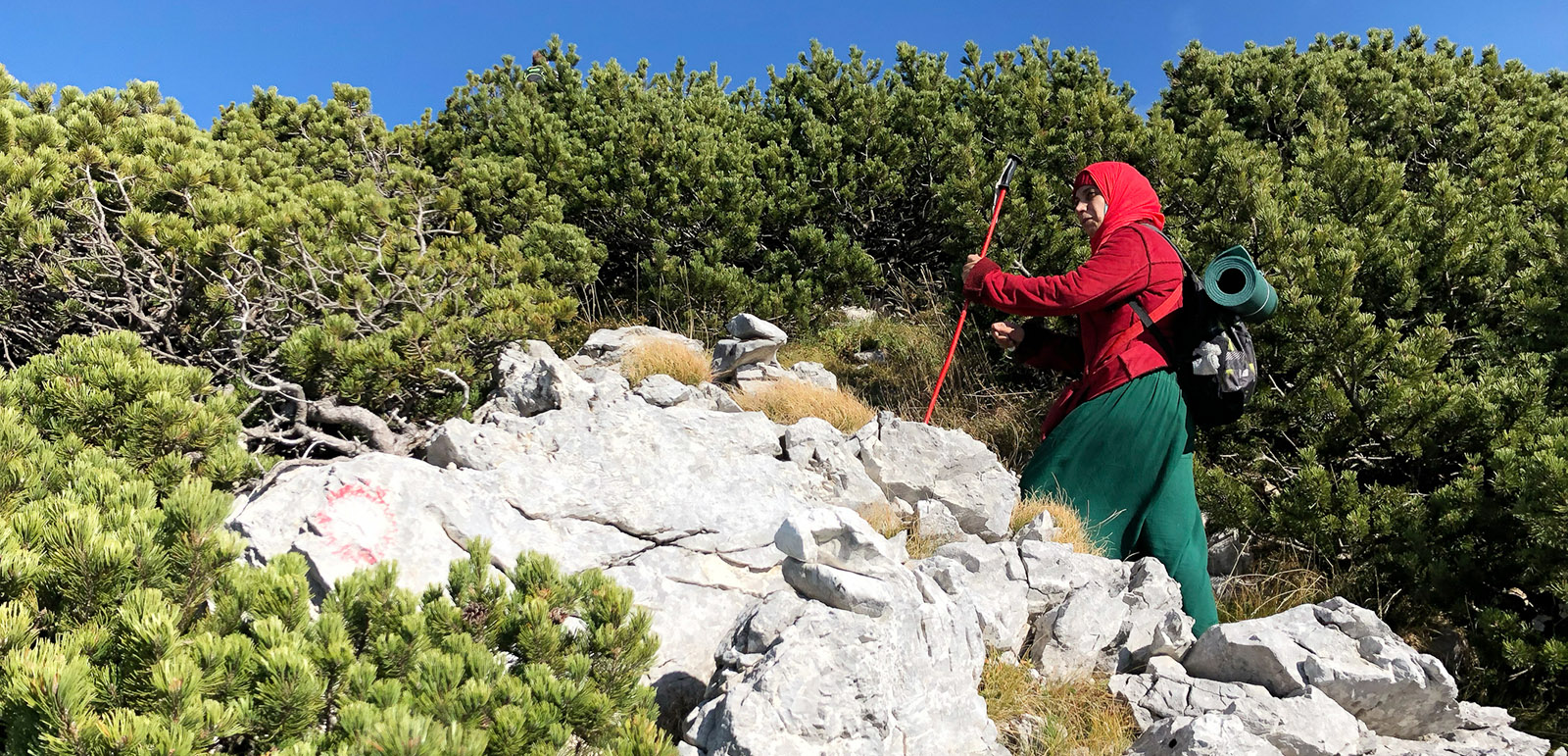 Muslim woman hiking on mountain
