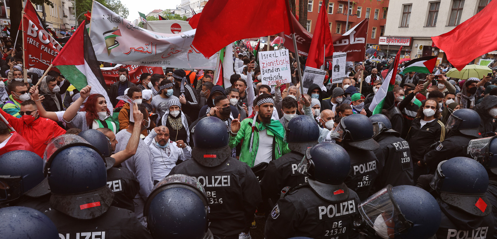BERLIN, GERMANY - MAY 15: Protesters face riot police as they march on Al Nakba Day to demonstrate for the rights of Palestinians in Neukoelln district on May 15, 2021 in Berlin, Germany. This year's protests are taking place in the context of ongoing, severe violence between Palestinian militias and Israeli security forces in Israel. Al Nakba Day commemorates the expulsion of hundreds of thousands of Palestinians from Palestine between 1947 and 1949 in the course of conflicts between the nascent state of Israel and neighbouring Arab countries. (Photo by Sean Gallup/Getty Images)