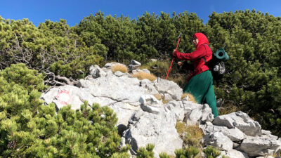 Muslim woman hiking on mountain
