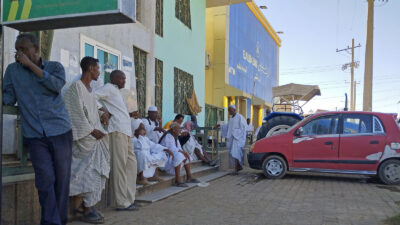 People queue outside Khartoum bank during Sudan conflict, 2 May 2023