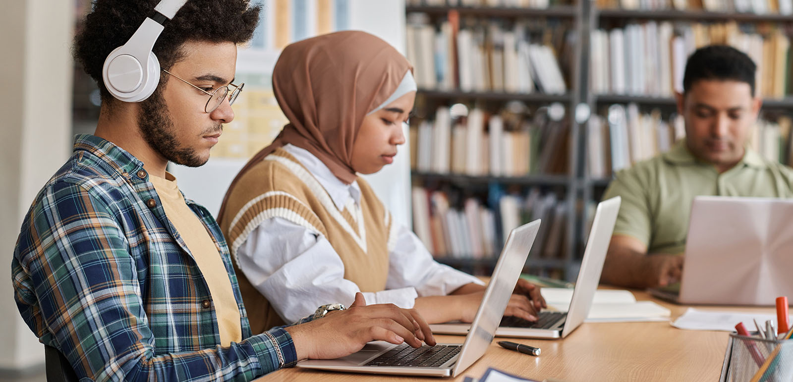 Students using computers in a library 