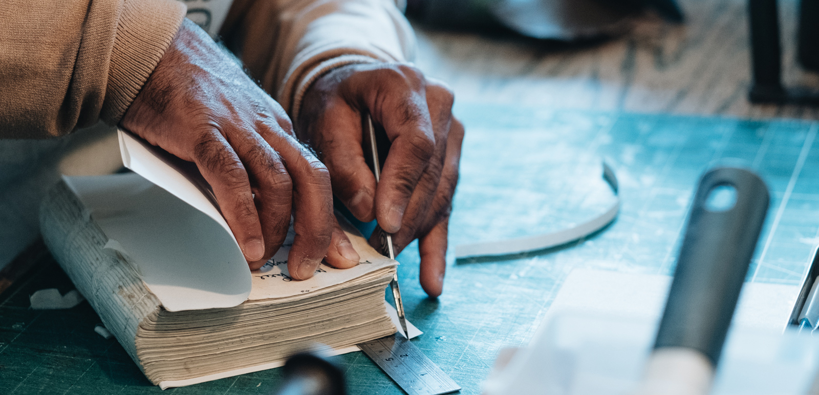 Book binder and Qur'an repair expert Ziyaad Lorgat photographed in Leicester for Hyphen by Hassan Raja.