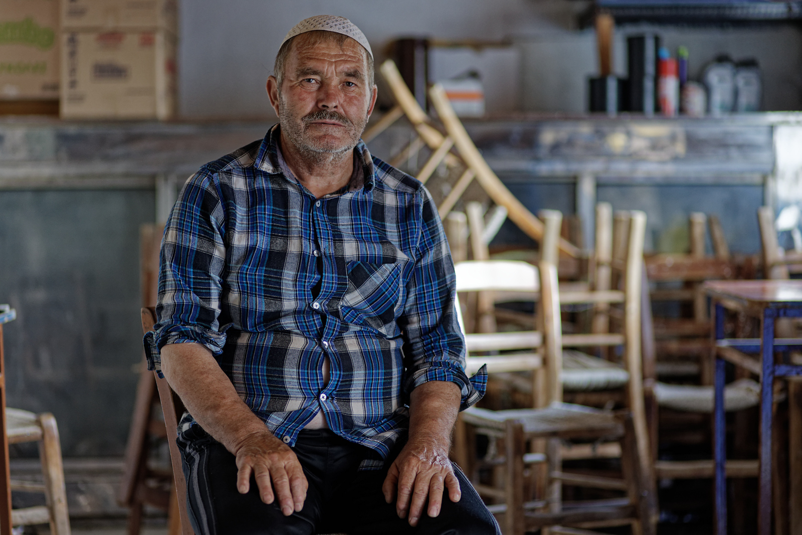 Ahmed Ahmet, 70, is the owner of the traditional cafe-grocery where former Greek foreign minister Dora Bakoyanni held her town hall. Photography for Hyphen by Iason Athanasiadis