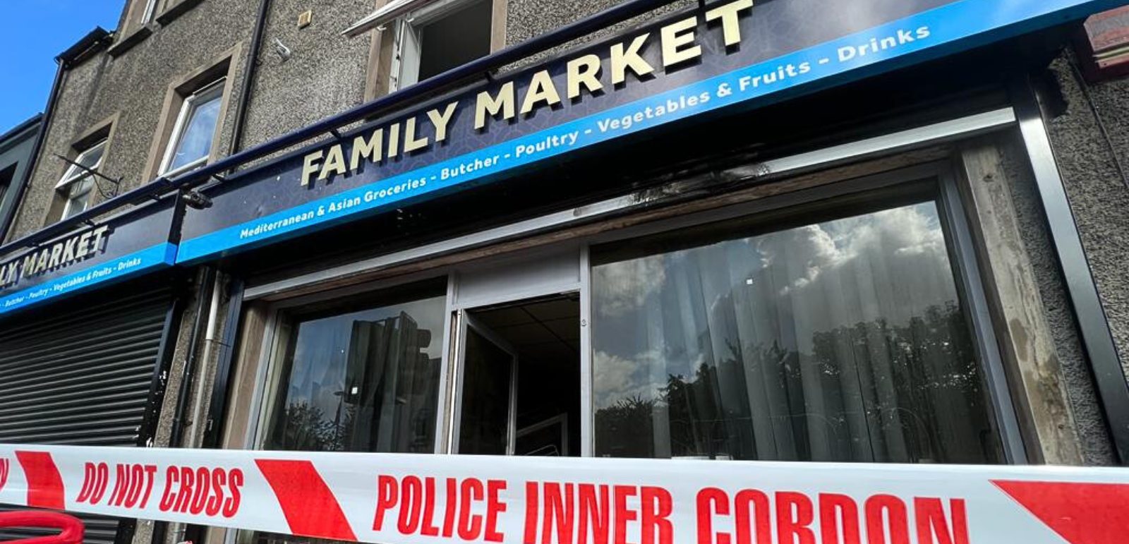 A police-cordoned Belfast grocery store was closed following anti-Muslim attacks on its premises on Donegall Road