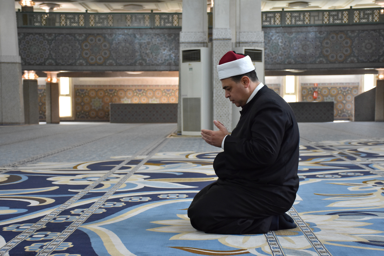 A worshipper prays in solitude inside the Grand Mosque.