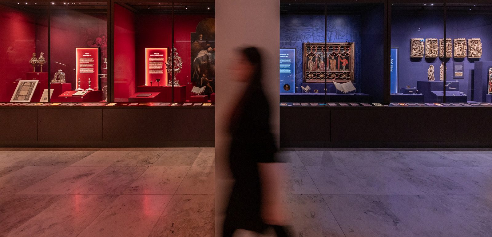 A woman passes by the Faith Museum collection. Photograph courtesy of The Faith Museum, Bishop Auckland