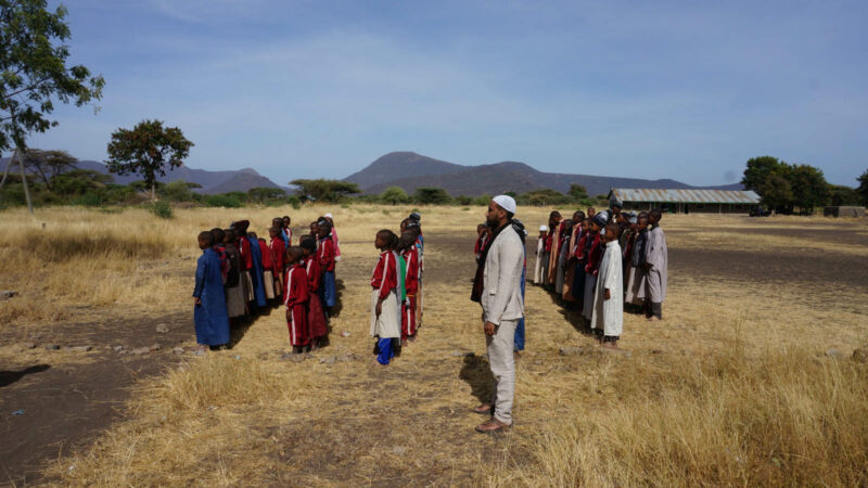 Hassan Noor Sayid (aka Aar Maanta) with children from Wamy School and Orphanage Home in Isiolo, Kenya, photographed by Mohamed Mohamud for his Somali Sideways project