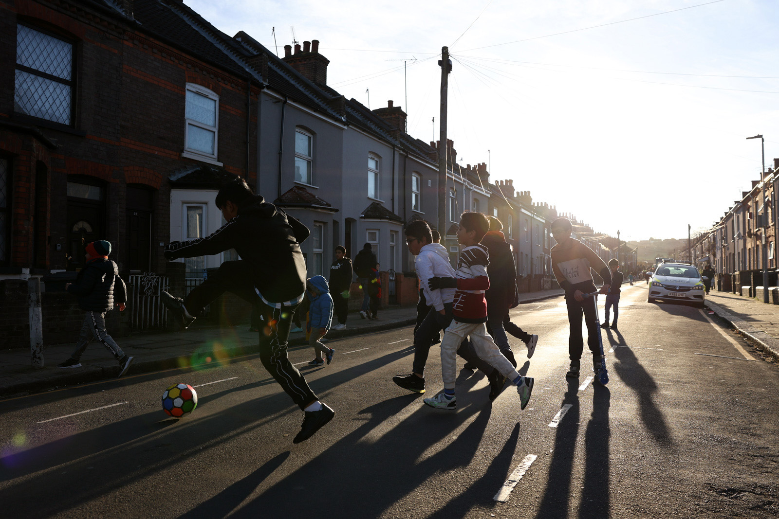 LUTON, ENGLAND - NOVEMBER 25: Young football fans are seen playing football near the stadium prior to the Premier League match between Luton Town and Crystal Palace at Kenilworth Road on November 25, 2023 in Luton, England. (Photo by Richard Heathcote/Getty Images)
