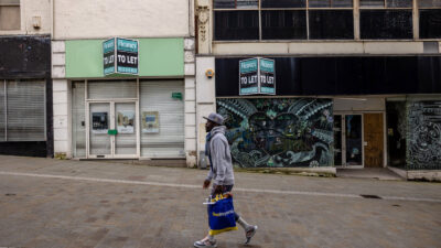 A shopper walks through an empty Bradford high street