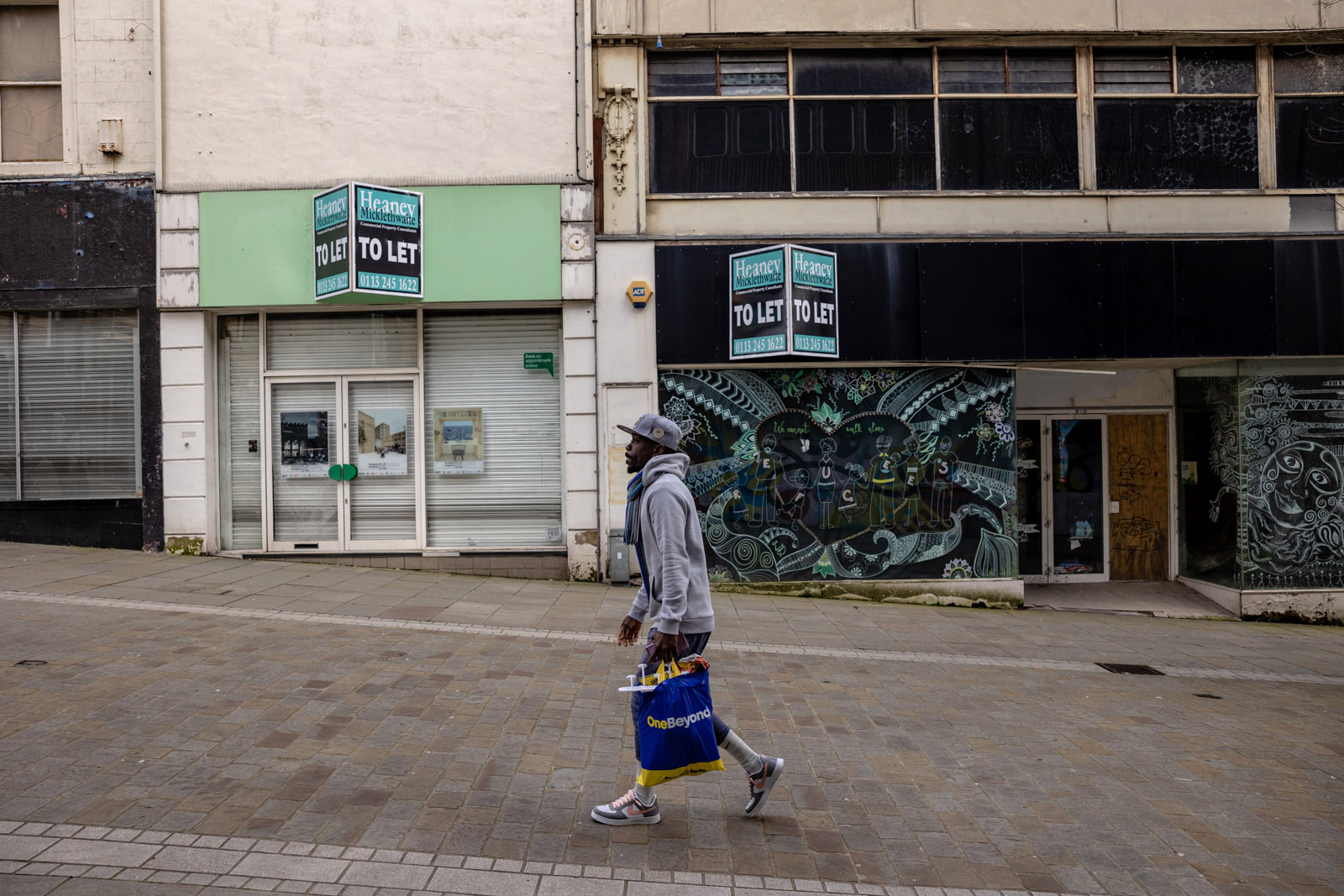 A shopper walks through an empty Bradford high street