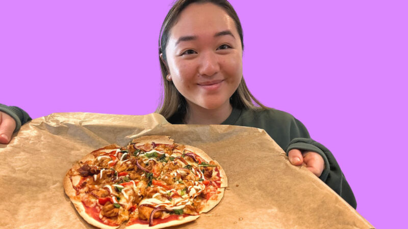 Michelle Lee holds her piri piri chicken wrap pizza.