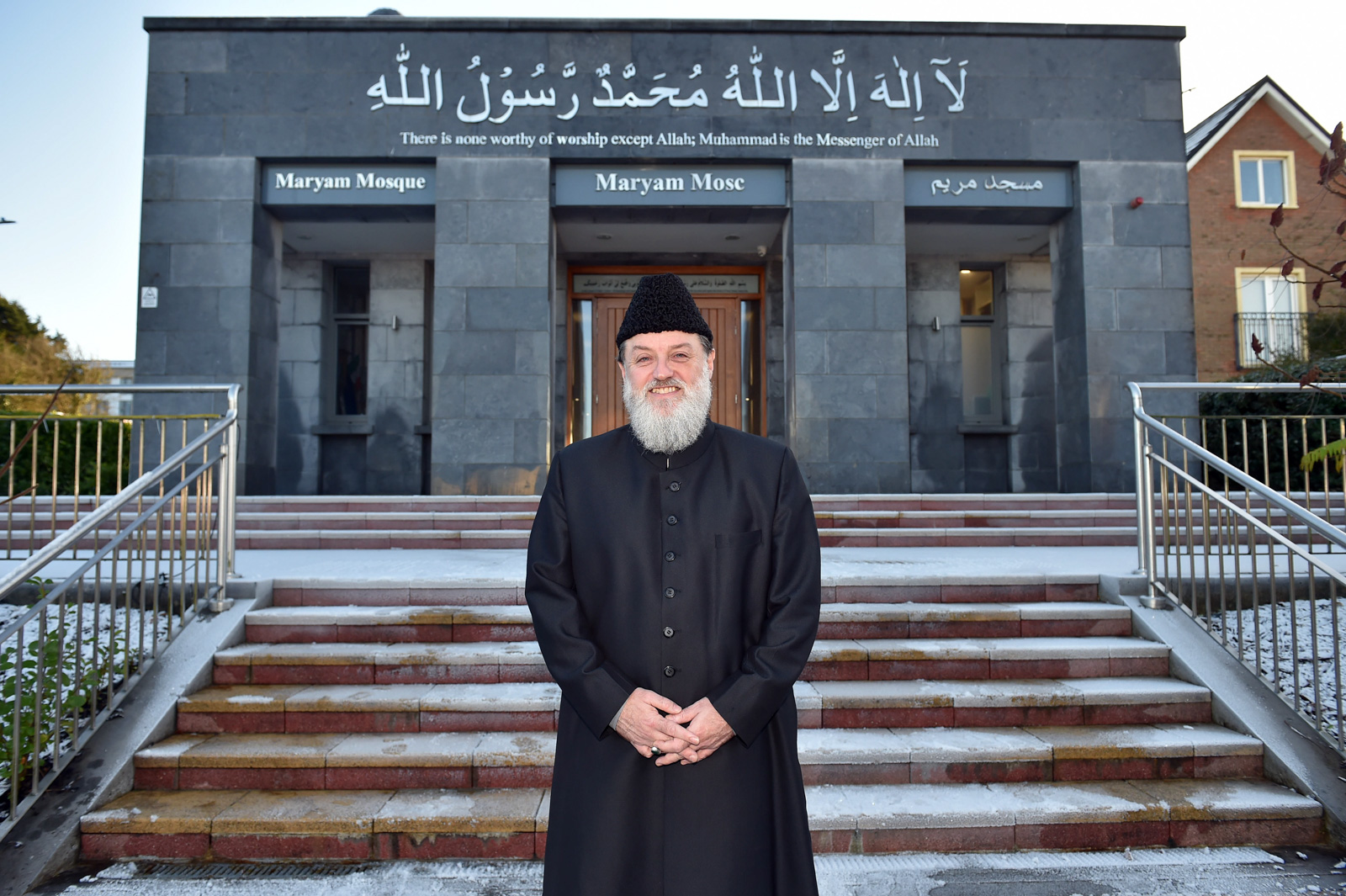 The imam of Galway poses for a photo outside the entrance of the Maryam Mosque in Galway, Ireland. Ibrahim Michael Noonan