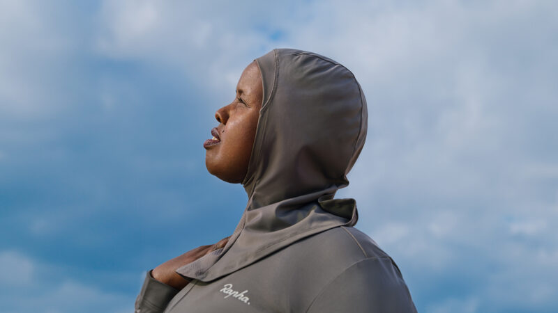 A woman models a cycling hijab. Photo courtesy of Rapha