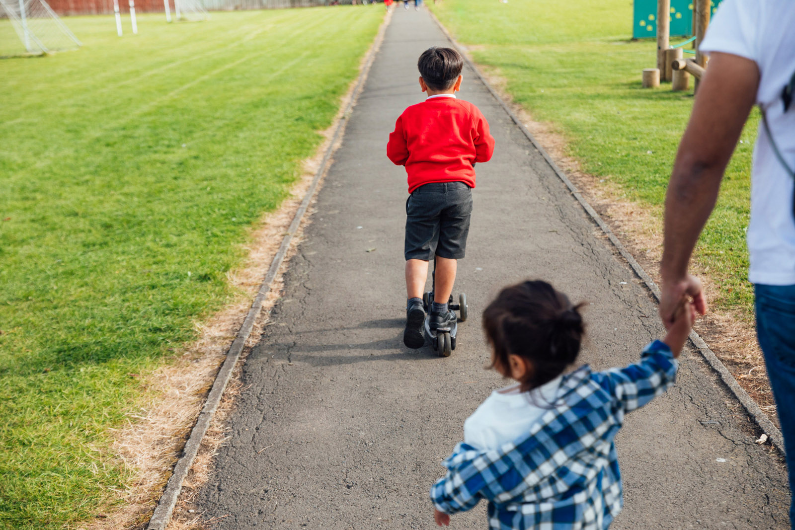 Two children in a park. Stock photo by SolStock/Getty Images