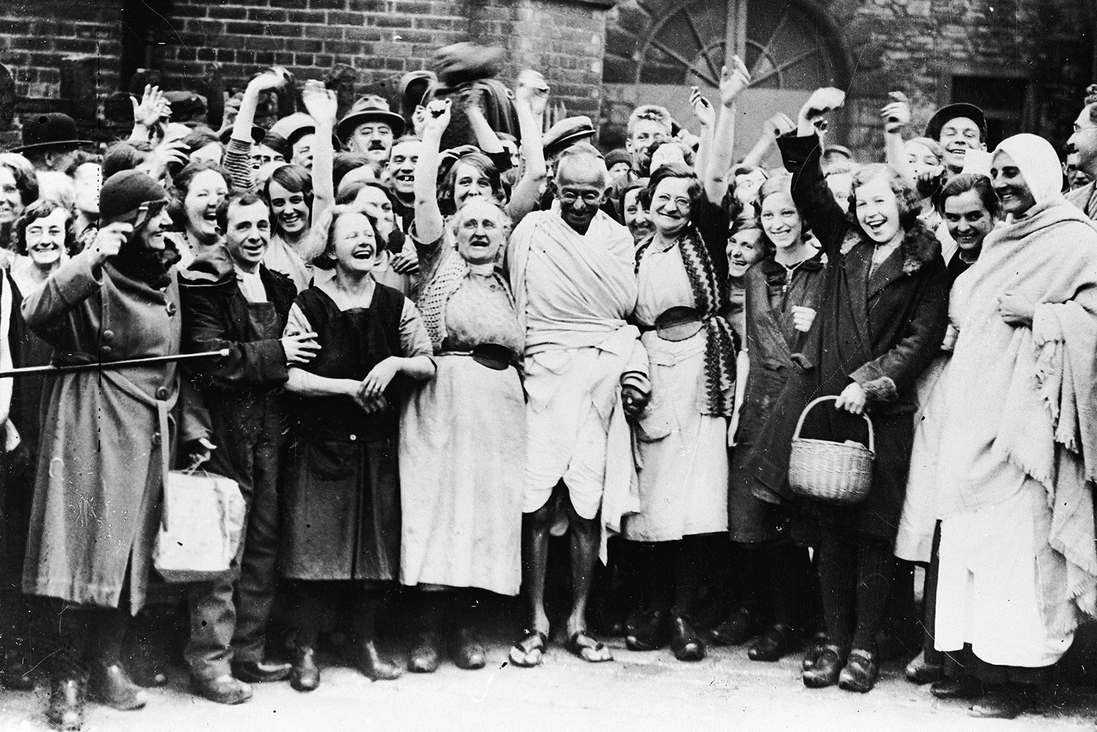 Despite leading an anti-colonial boycott of British goods, Mahatma Gandhi was well received by textile workers on his visit to Darwen, Lancashire in 1931. Photo by Keystone/Getty Images