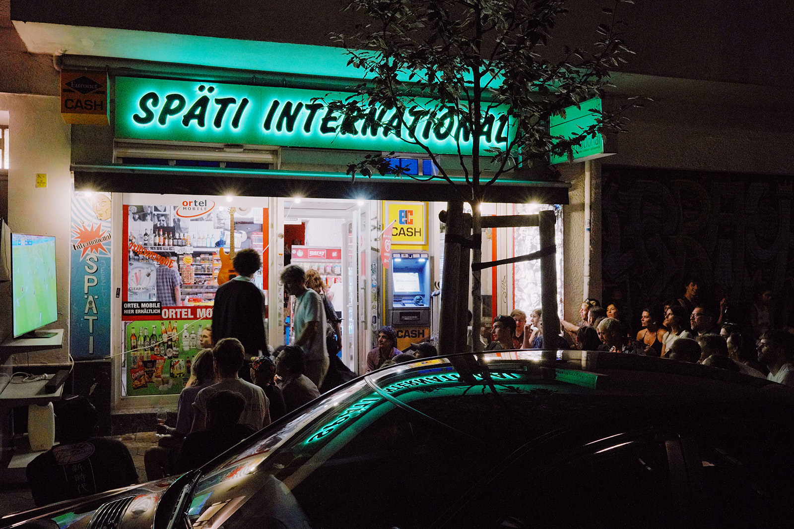 Fans gather to watch a Euro 24 game at Späti International on Weserstraße, Neukölln. Photography for Hyphen by Muhammad Salah