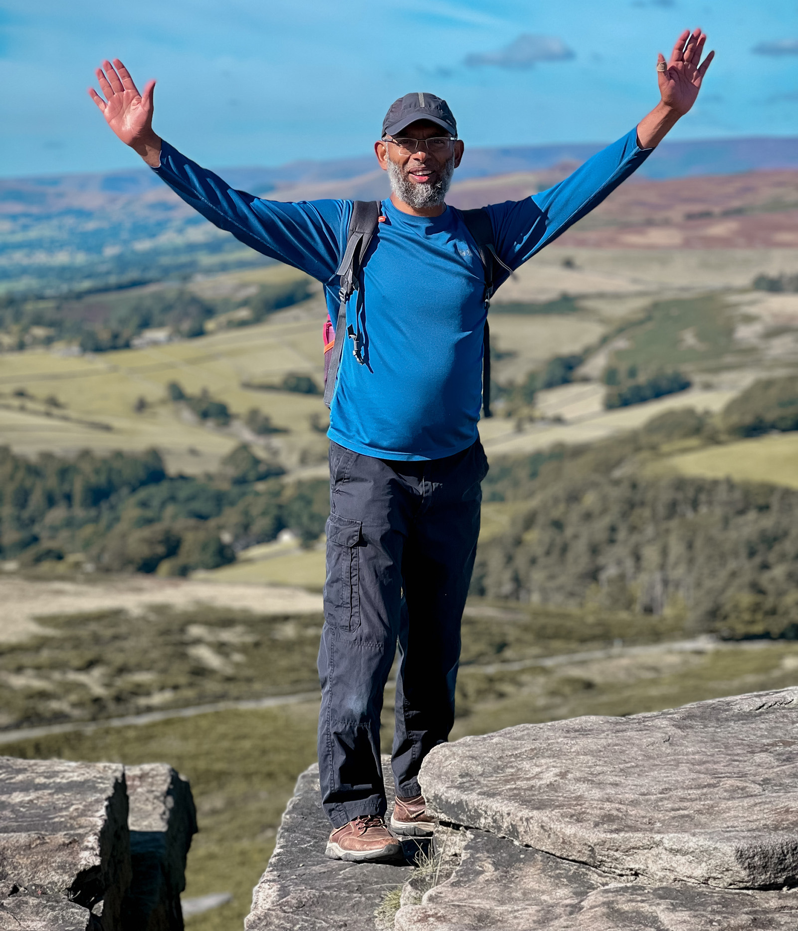Faisal Mohammed Khaffar from Muslim Family Adventures at Stanage Edge in the Peak District. Photo by Muslim Family Adventures