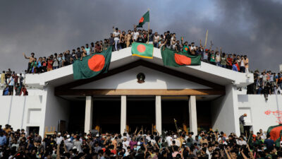 Protesters on top of the prime minister's palace in Bangladesh. Photo by KM Asad via Getty Images
