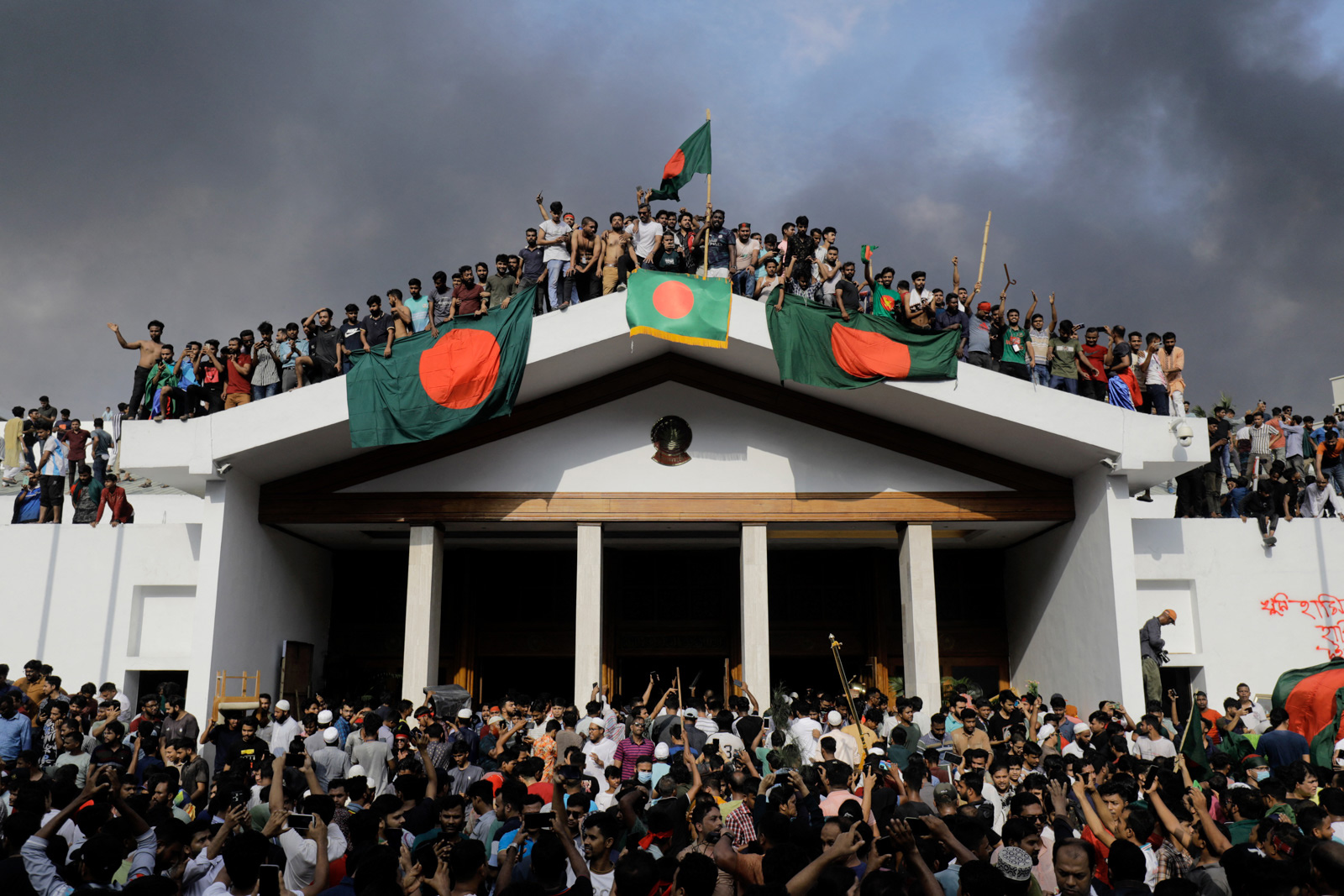 Protesters on top of the prime minister's palace in Bangladesh. Photo by KM Asad via Getty Images