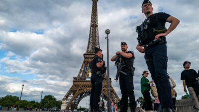 French gendarmes patrol near the Eiffel Tower ahead of the Paris 2024 Olympic Games. Photo by Jewel Samad/AFP/Getty Images