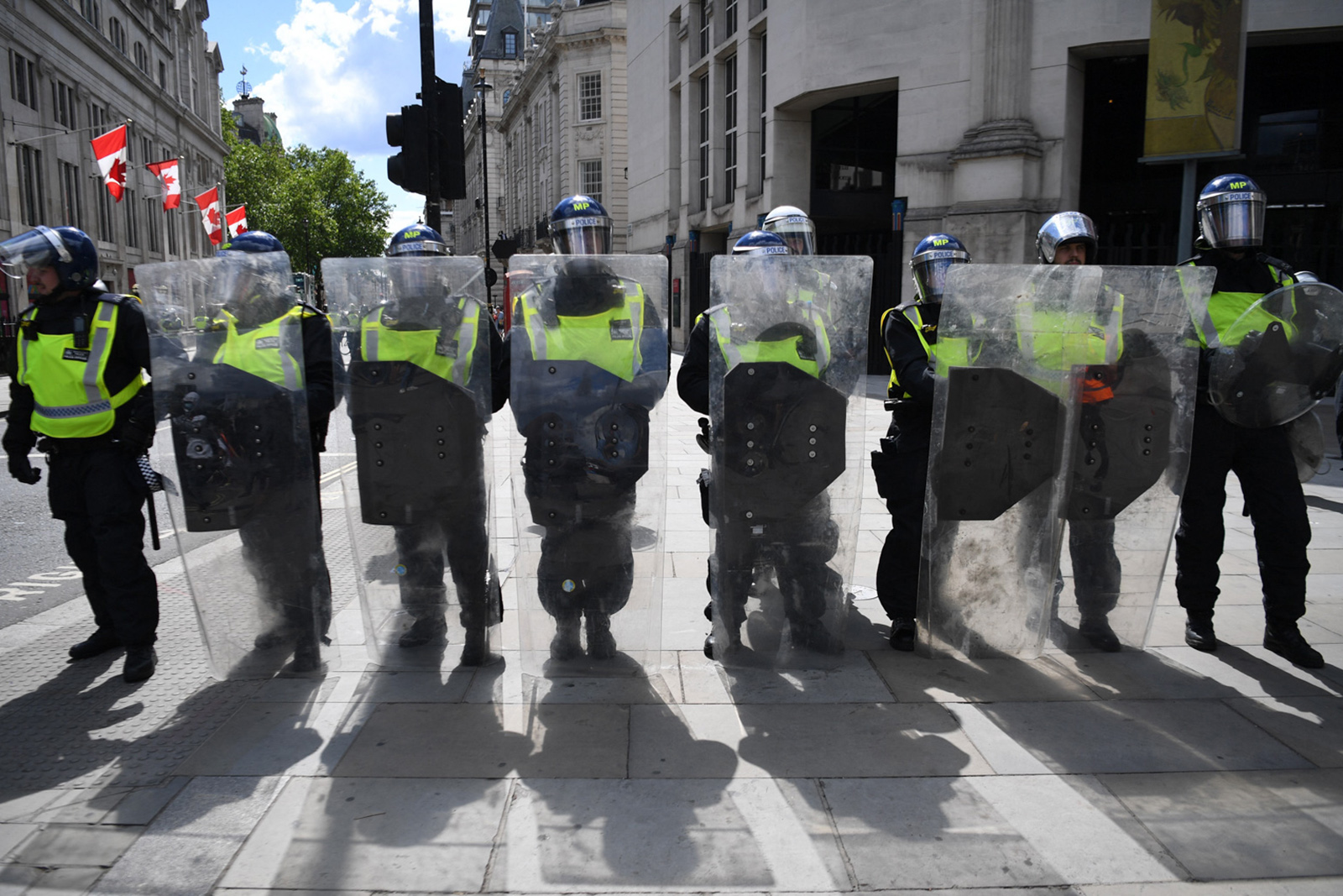 A line of riot police block the entrance to Whitehall at a Black Lives Matter protest  in central London on 13 June 2020, in the aftermath of the death of unarmed black man George Floyd in police custody in the US. Photo by Daniel Leal / AFP via Getty Images