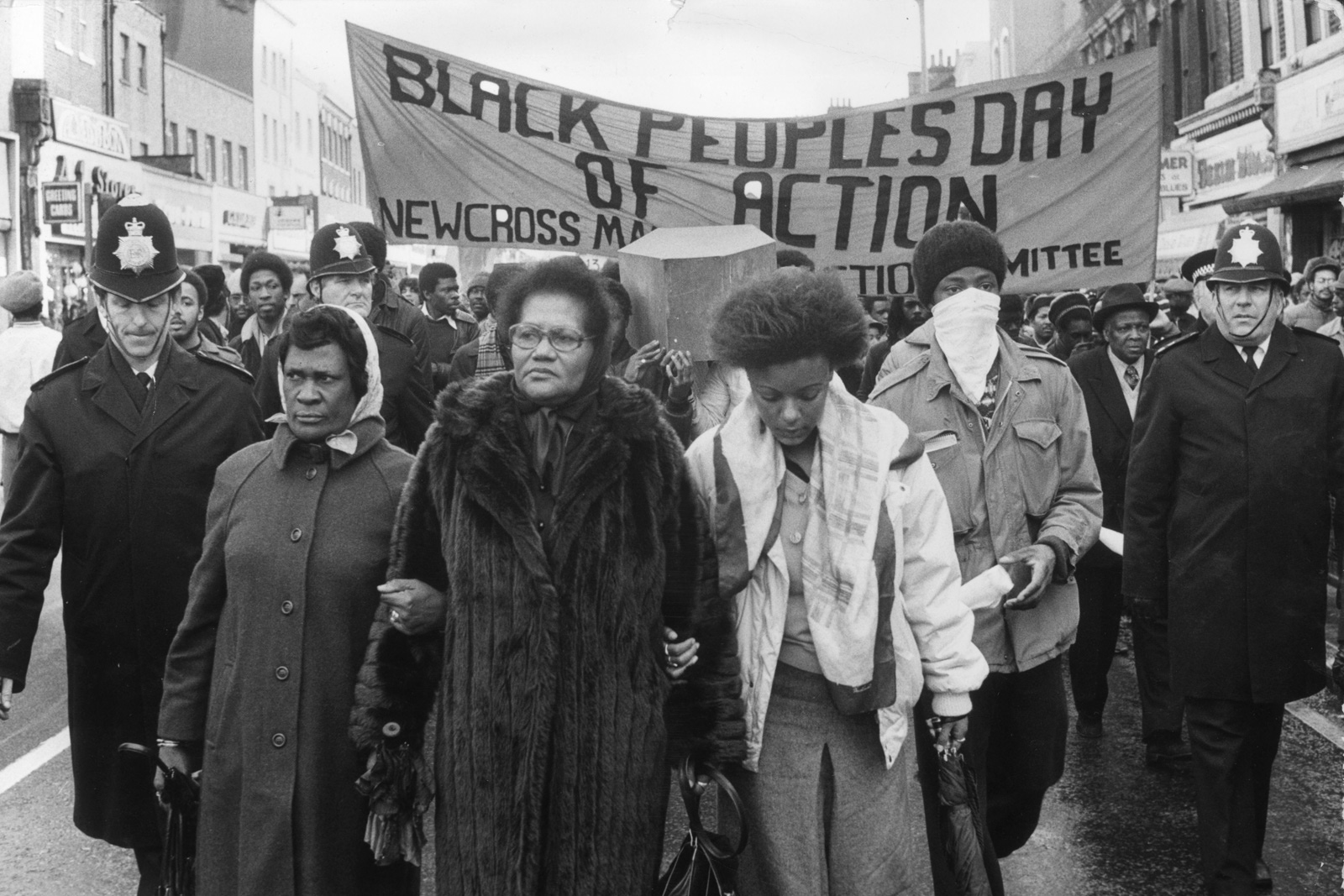 2nd March 1981: Grieving protesters march from New Cross to the House of Commons under a banner proclaiming the Black People's Day of Action, after 13 black people were killed in the New Cross house fire of 18th January 1981. The fire aroused anger within the local community with allegations of a police cover-up of a racial attack. 20,000 people marched in the protest organised by the New Cross Massacre Action Committee (NCMAC). Photo by Graham Turner/Keystone/Hulton Archive via Getty Images