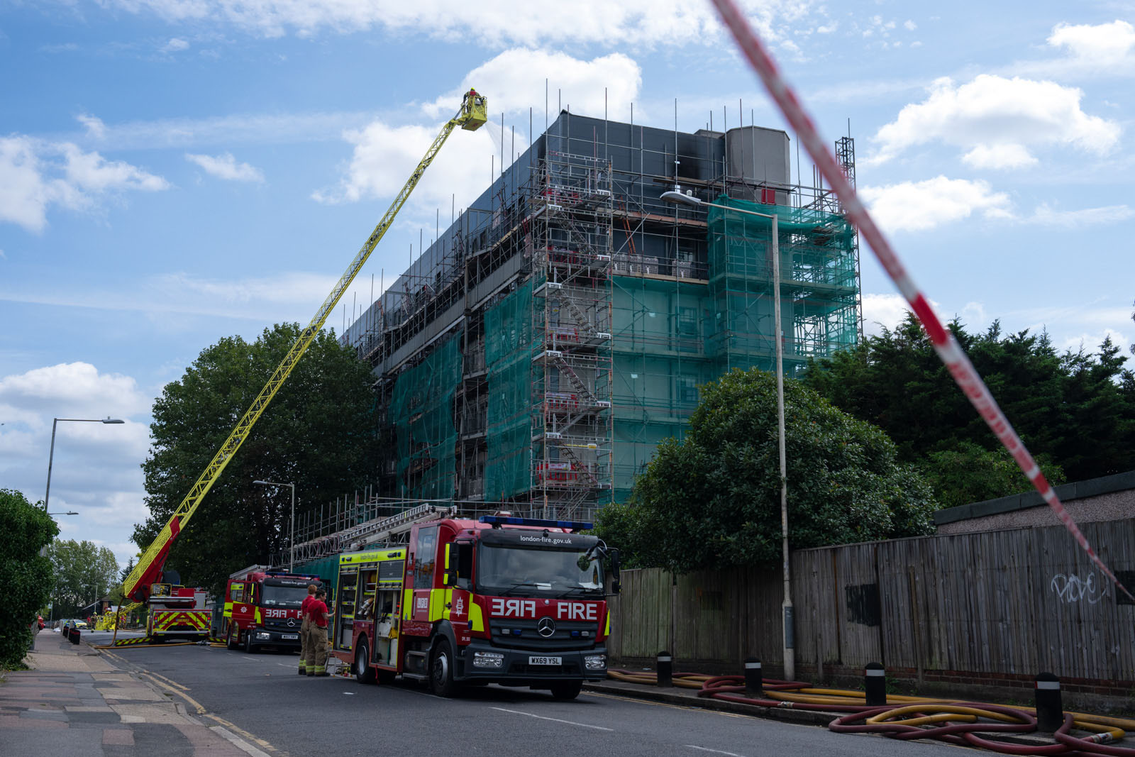 Firefighters work at the scene of an apartment block fire on August 27, 2024 in Dagenham, England. A fire engulfed the tower block on Freshwater Road, Dagenham in the early hours of Bank Holiday Monday morning. The building was undergoing works to remove unsafe cladding, similar to that used in Grenfell Tower. Residents were evacuated and are being housed temporarily in a nearby Leisure Centre. Photo by Carl Court/Getty Images