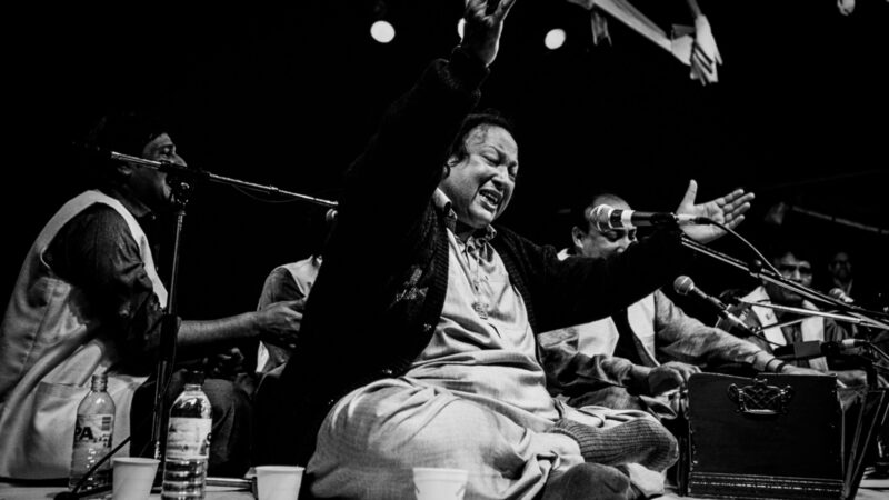 Nusrat Fateh Ali Khan, known as the Shahenshah-e-Qawwali — the king of kings of qawwali – performing at the 1993 Womad festival in Reading. Photo by David Levenson via Getty Images