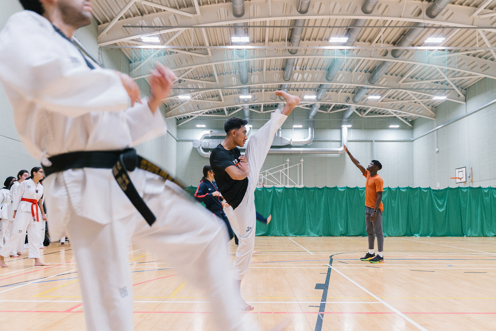 Participants practise taekwondo at the London Taekwondo Academy in West Acton, London