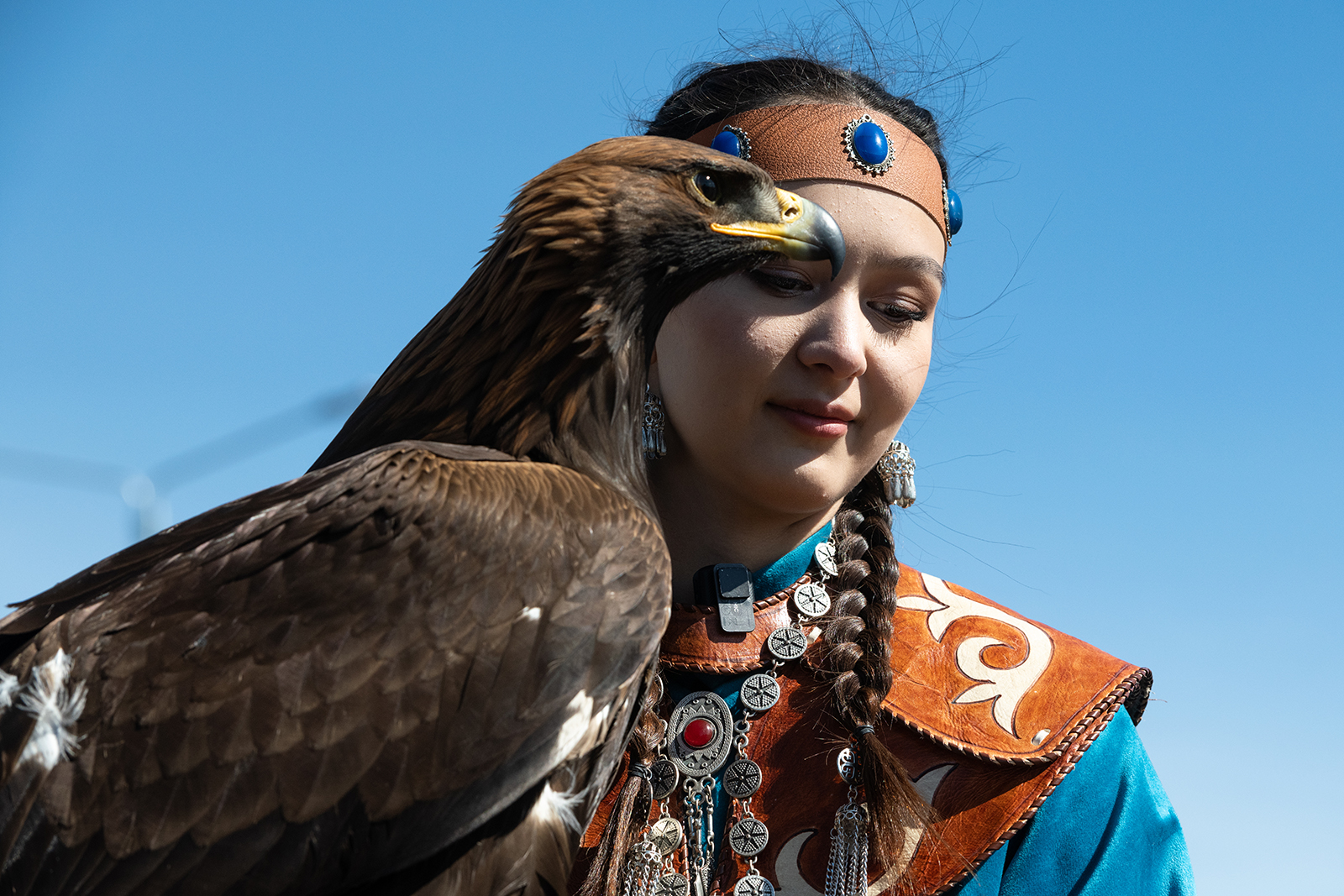 A woman holds a hunting eagle at the 2024 World Nomad Games in Astana, Kazakhstan. 