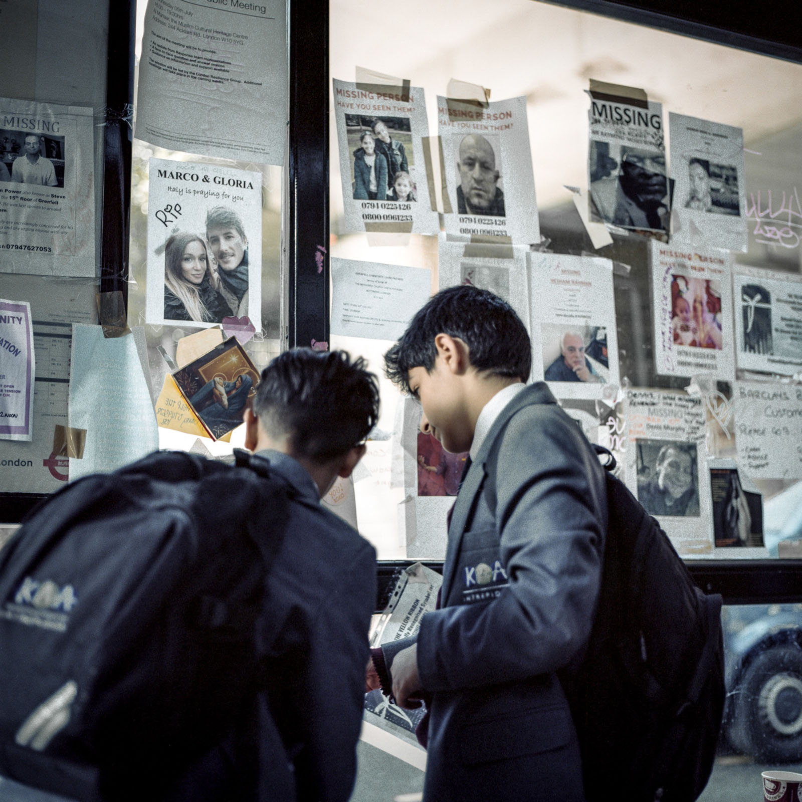 At the local bus stop on Latimer Road, students looked at flyers of missing Grenfell Tower residents, many of whom would later be pronounced dead. Photography by Nicola Muirhead