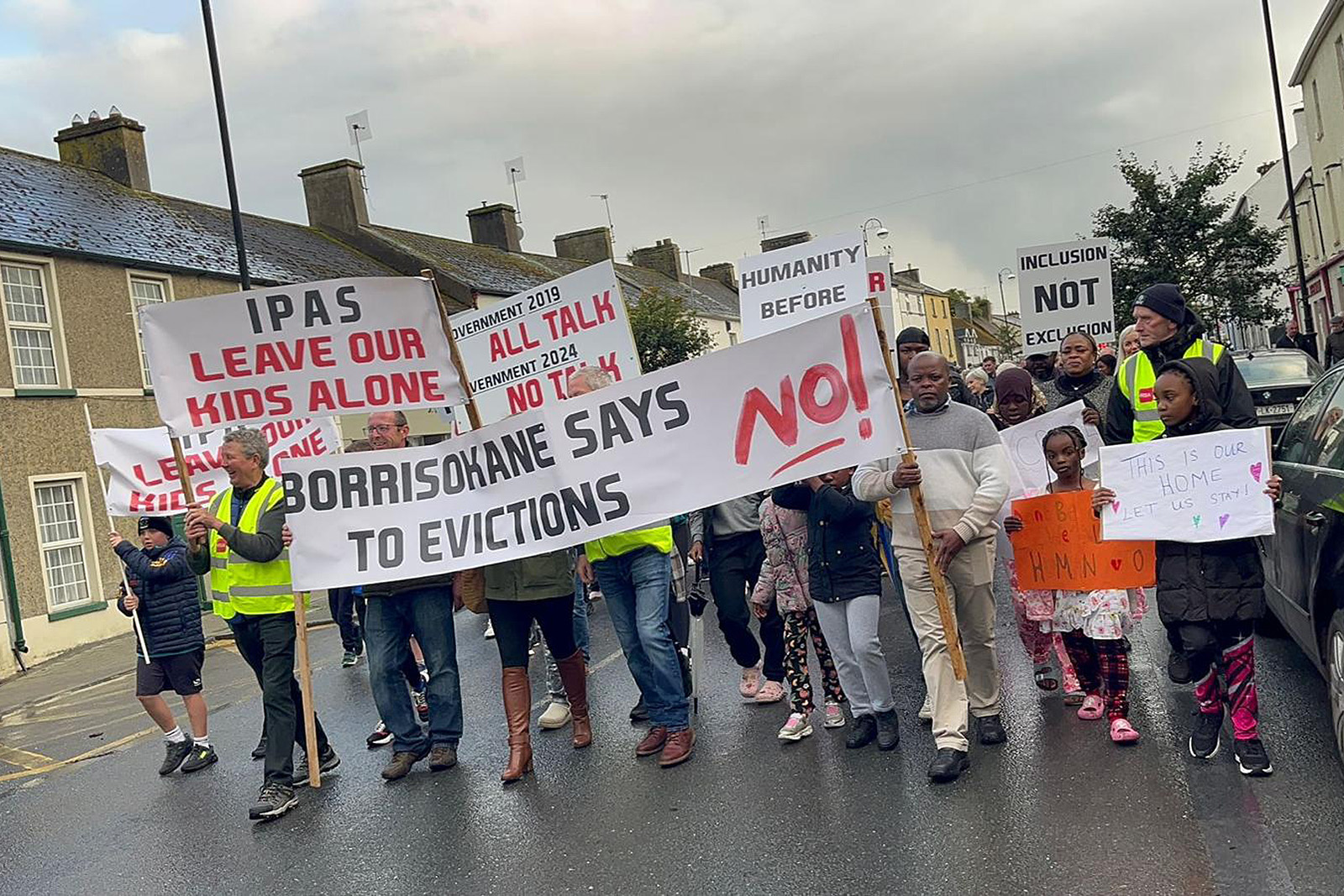 The Borrisokane community marches along the street in protest at the forced eviction of asylum seekers housed in their town