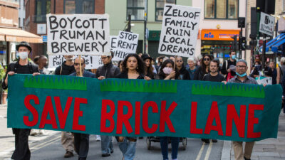 Local residents and supporters of the Save Brick Lane campaign take part in a funeral procession along Brick Lane organised in protest against the ongoing gentrification of Shoreditch on 12th September 2021 in London, United Kingdom. Campaigners are protesting in particular against plans to develop the Truman Brewery into a shopping centre and 5-storey office building. Tower Hamlets experienced more gentrification than any other London borough between 2010-2016.