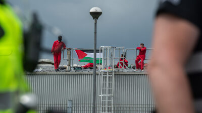 Police arrive as activists occupy the roof of the Thales UK arms factory on June 1, 2022 in Glasgow, Scotland. The French-based Thales, one of the world’s largest suppliers of military weapons, was targeted by activists with Palestine Action Scotland because of its work with Israeli weapons company Elbit Systems on the Watchkeeper Drone project, according to published reports.