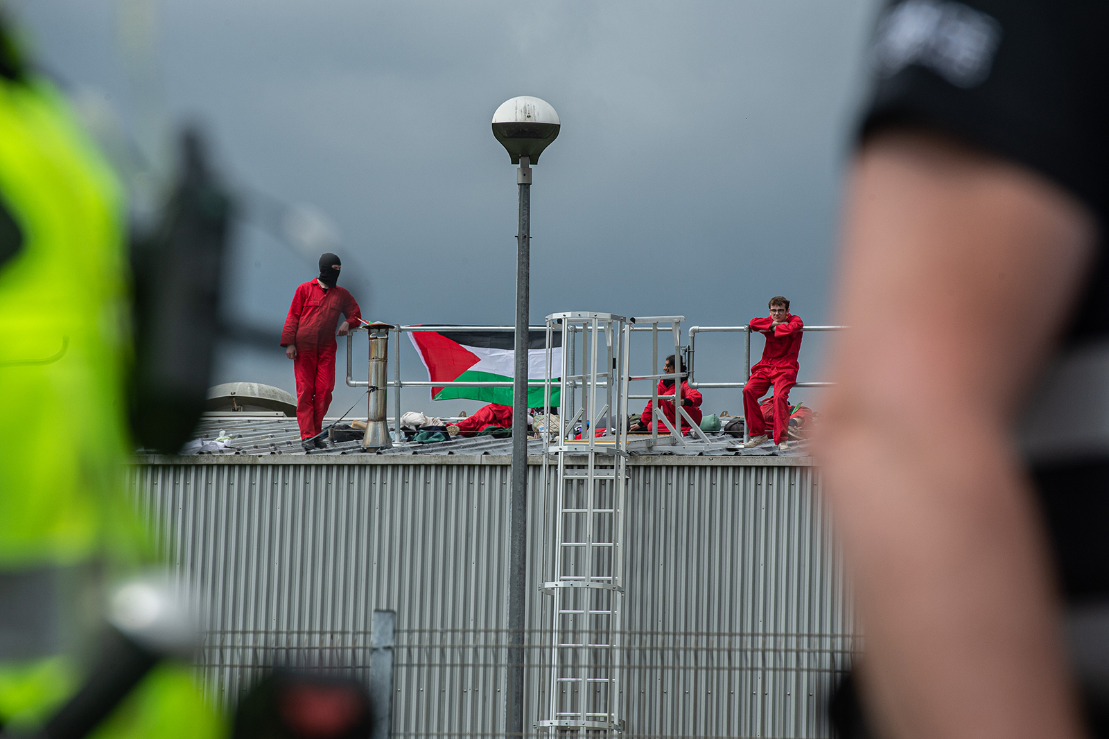 Police arrive as activists occupy the roof of the Thales UK arms factory on June 1, 2022 in Glasgow, Scotland. The French-based Thales, one of the world’s largest suppliers of military weapons, was targeted by activists with Palestine Action Scotland because of its work with Israeli weapons company Elbit Systems on the Watchkeeper Drone project, according to published reports.