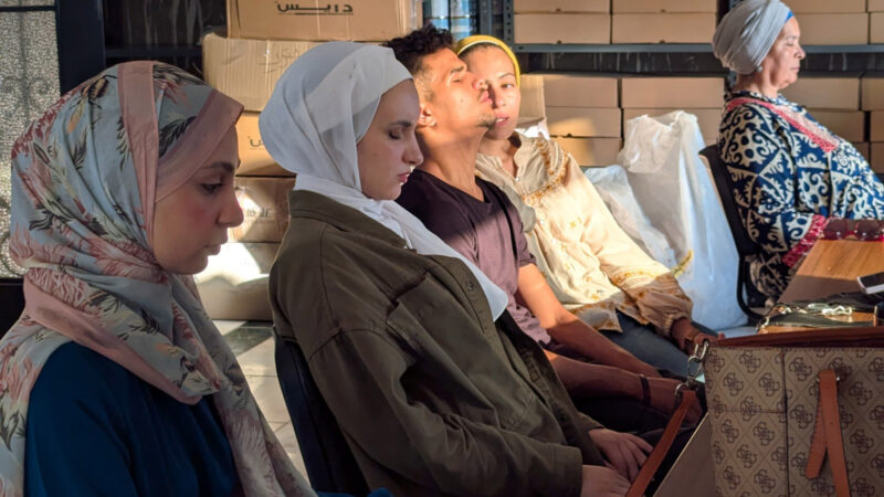 A row of Muslim women sit at a centre that provides volunteer therapy to Gazan refugees.