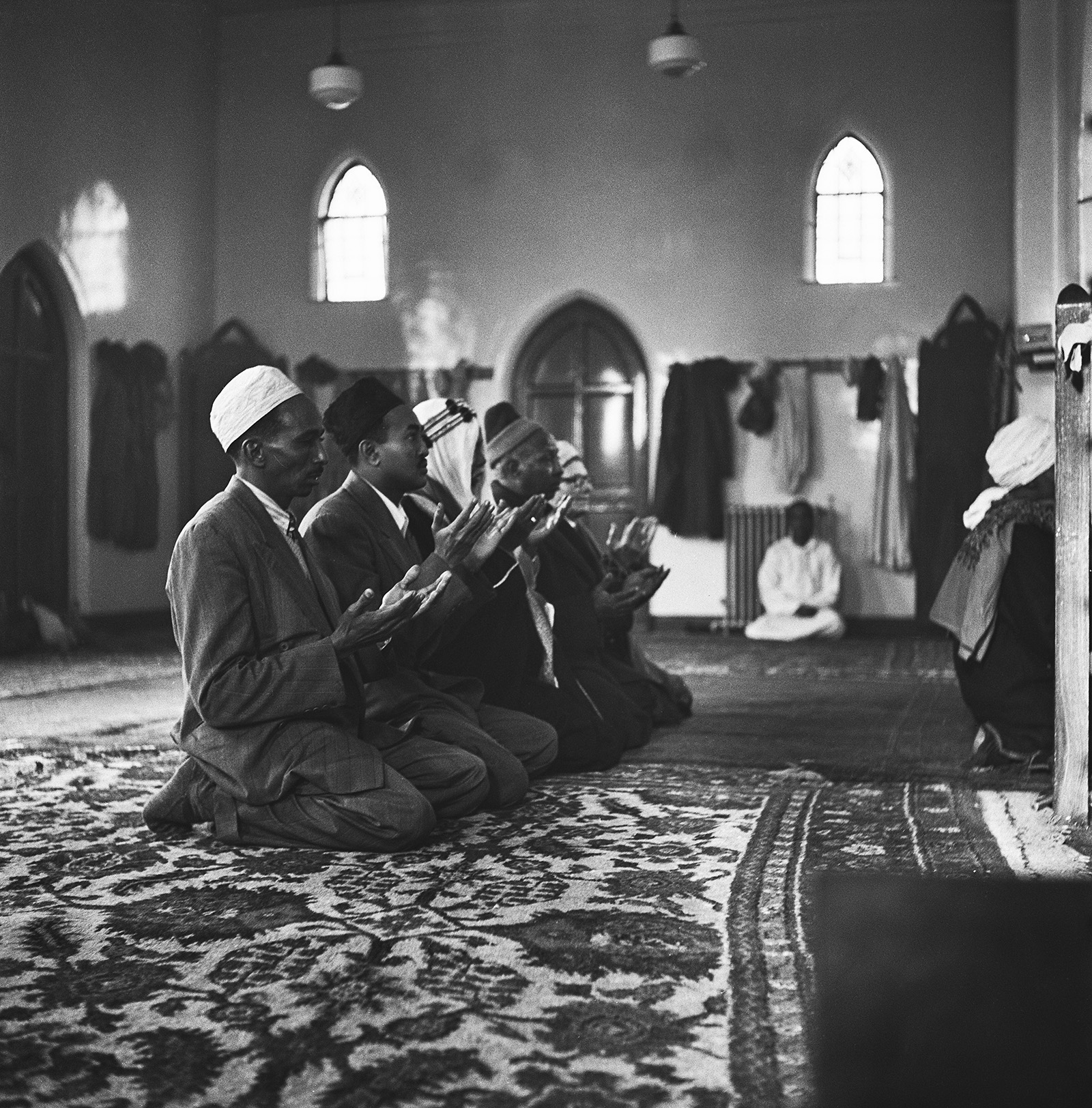 A group of Muslim men at prayer in Cardiff, south Wales, circa 1955. 