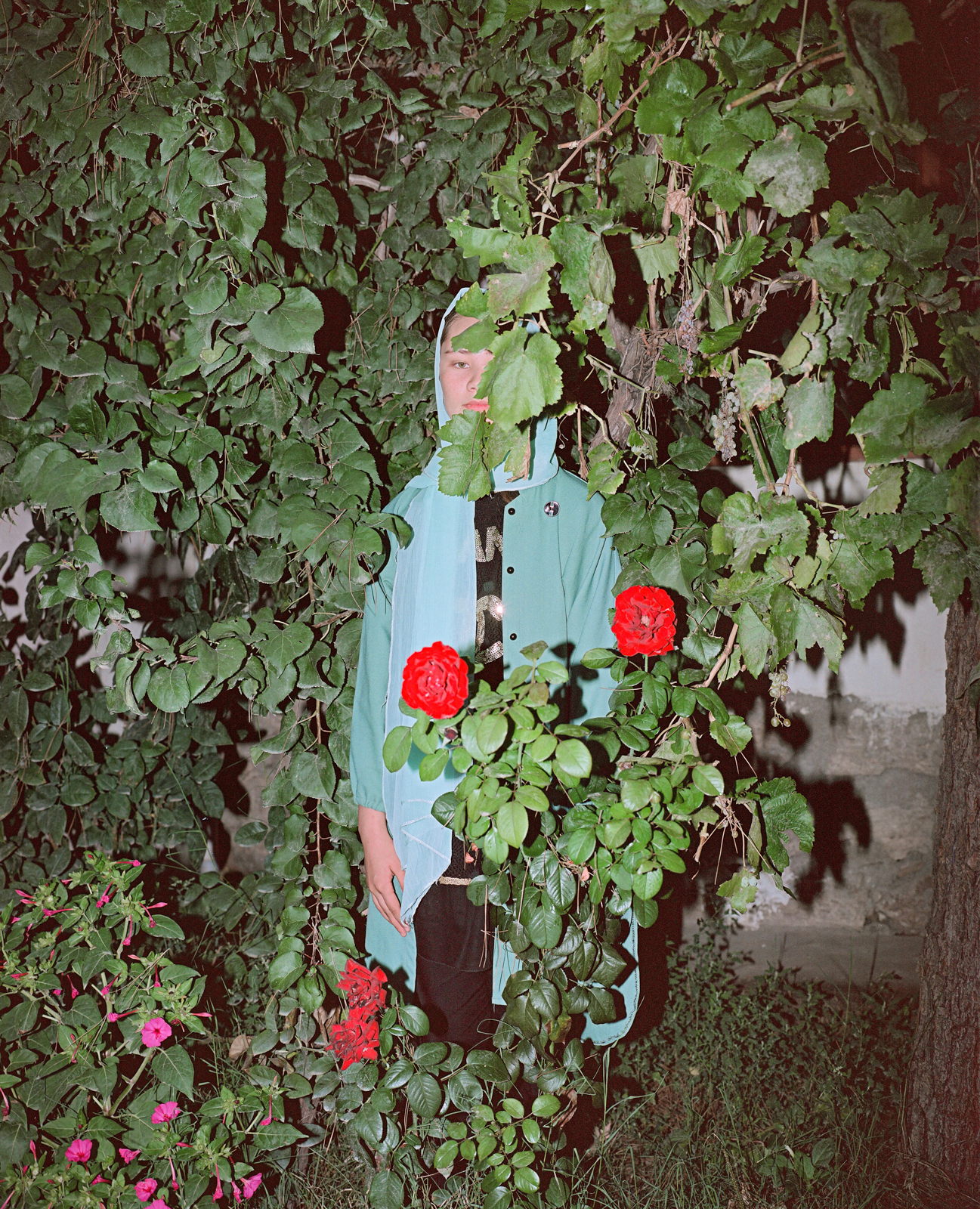 Setareh, a 17 year old Afghan girl stands in her garden in Kabul. 