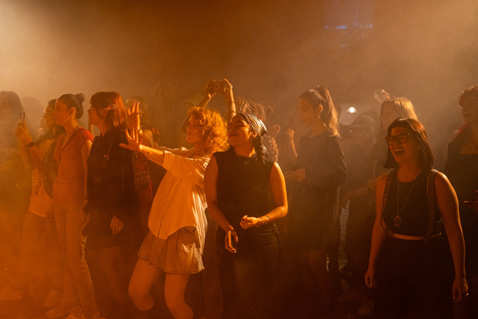 Audience members watching performance at FemArt Festival