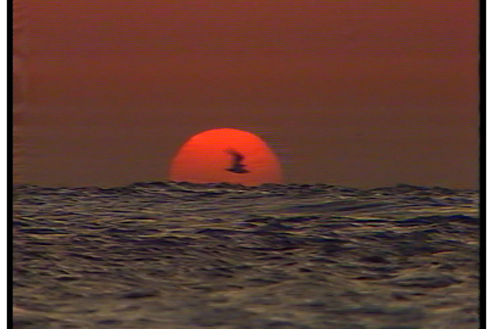 A scene of a setting sun over water from the film Israel Palestine on Swedish TV 1958-1989.