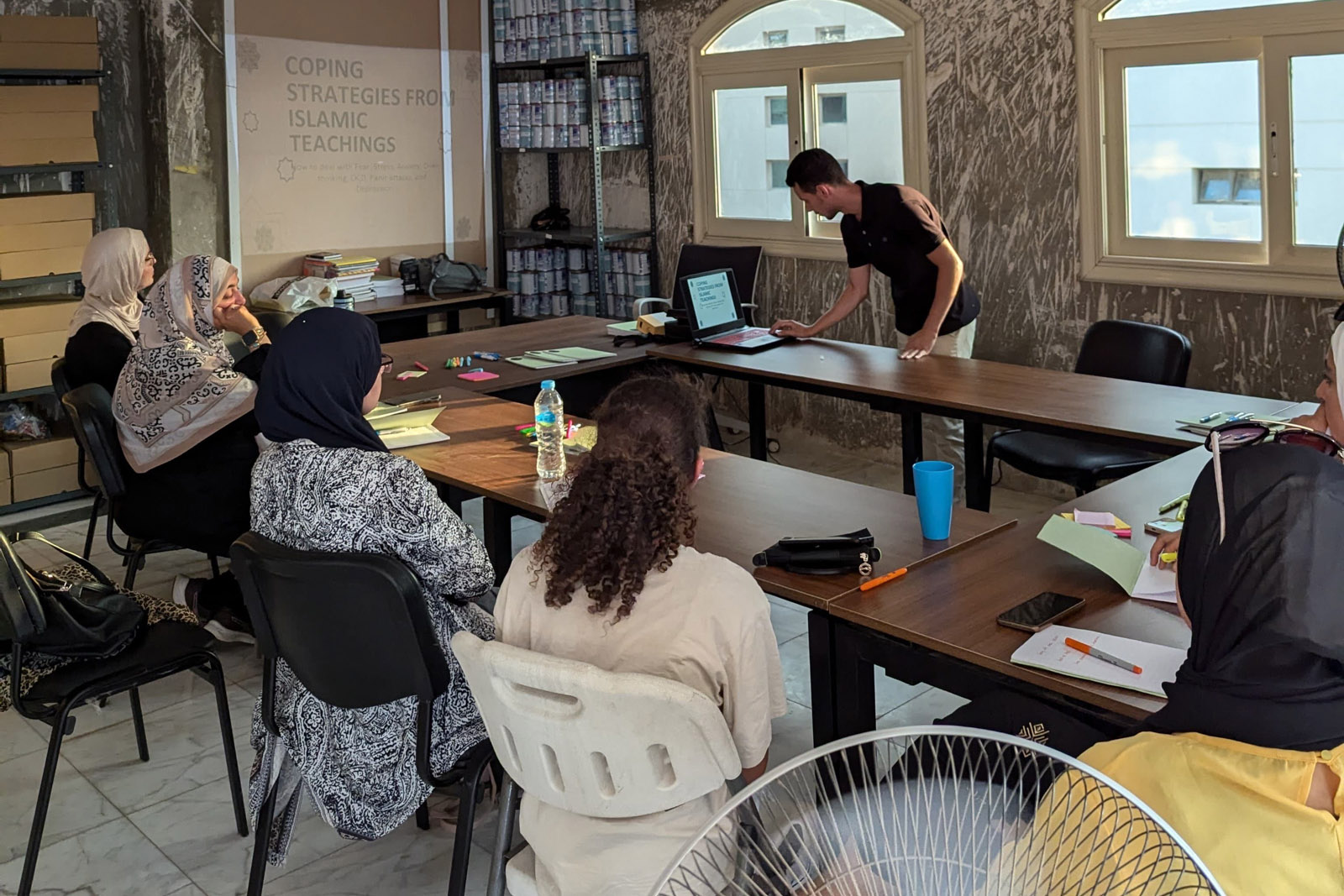 Volunteers receiving training on how to provide mental health support for displaced Palestinians at a workshop in Cairo