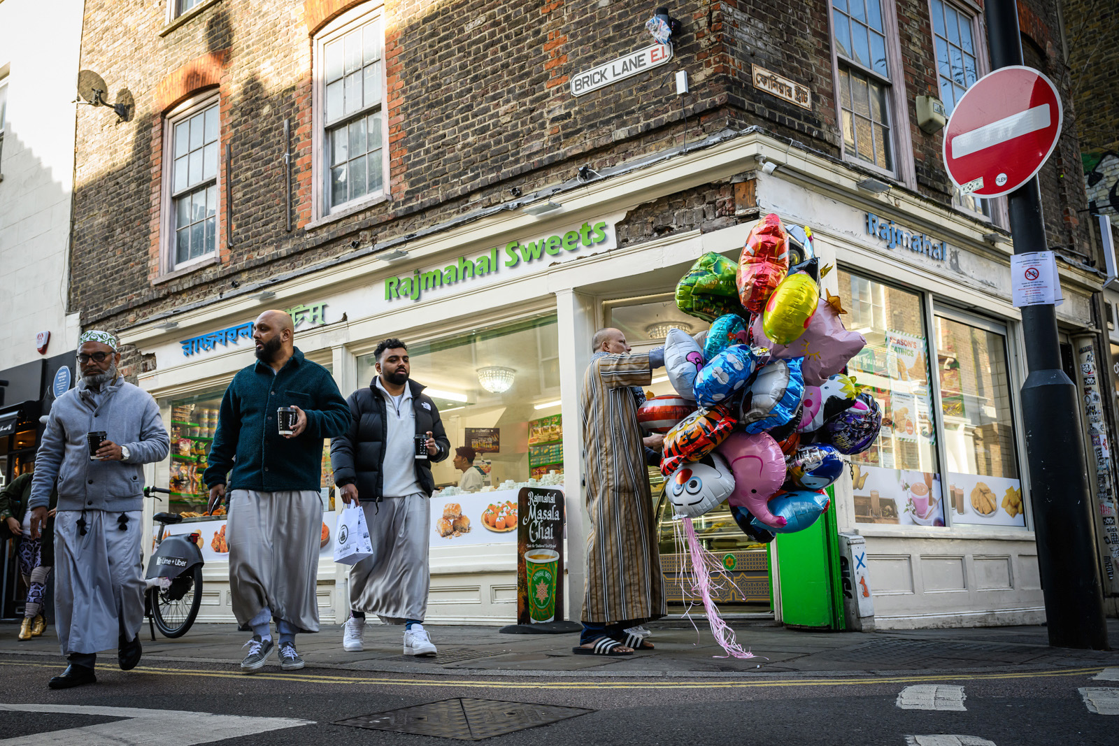 A man sorts colourful balloons outside a shop on Brick Lane as Ramadan comes to an end and Muslims around the world begin to celebrate Eid al-Fitr, on April 10, 2024 in London, United Kingdom.