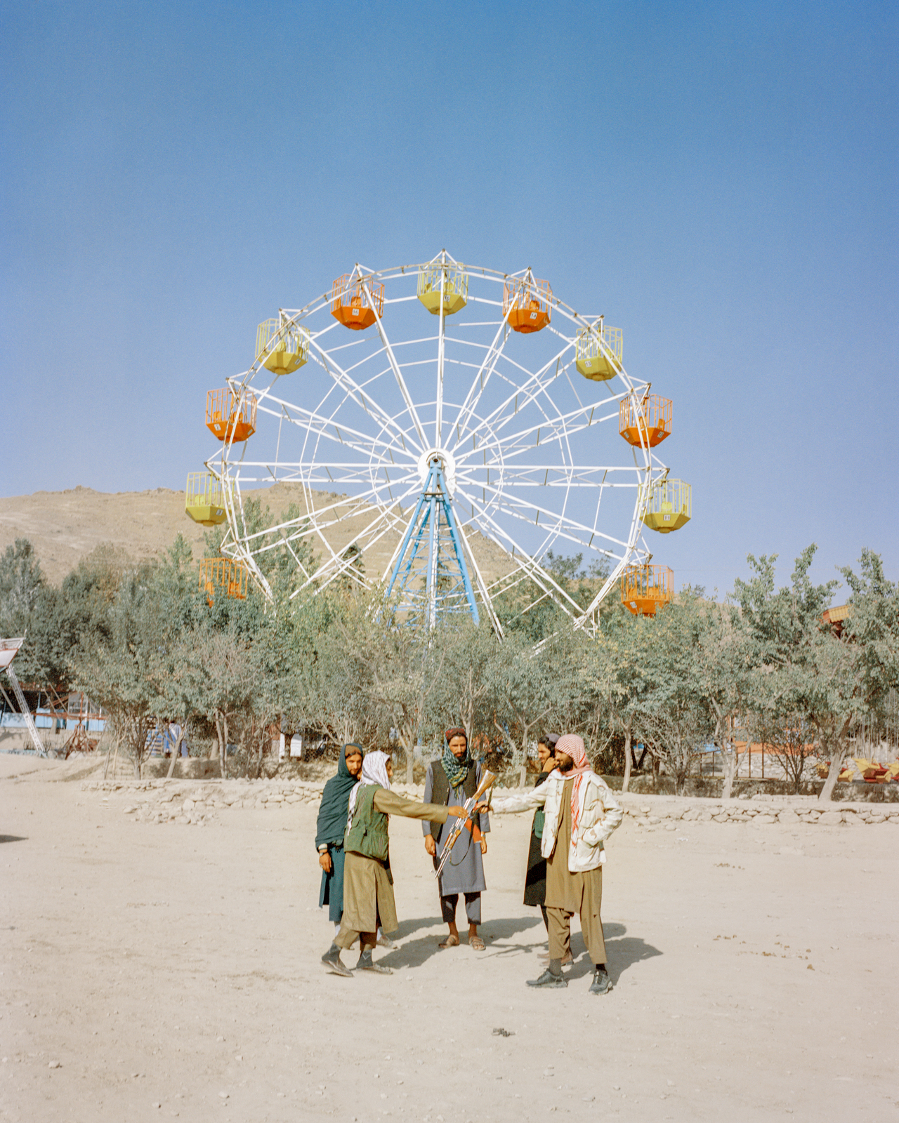 Taliban fighters visit an amusement park in Kabul. Ordinary Afghans rarely visit parks, zoos or recreational areas out of fear of the repercussions, and many public spaces have been taken over by Taliban fighters. 