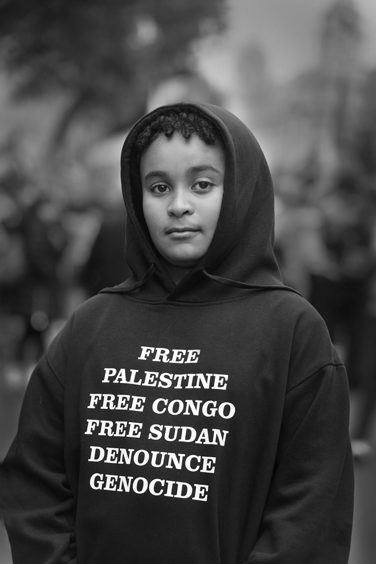 Portrait of Britain 2024 photography competition: Young Hakim, photographed outside Downing Street, highlights some of the many injustices in the world.