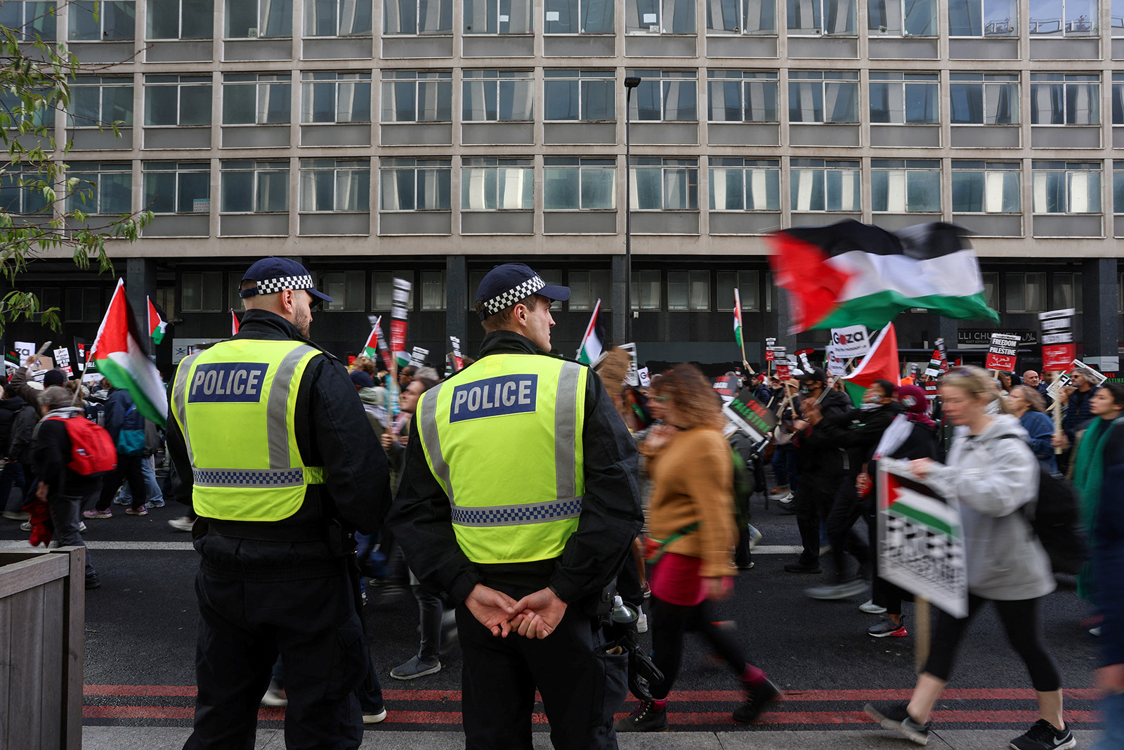 Police officers stand as demonstrators protest in solidarity with Palestinians in Gaza, amid the ongoing conflict between Israel and the Palestinian Islamist group Hamas, in London, Britain, 28 October, 2023.