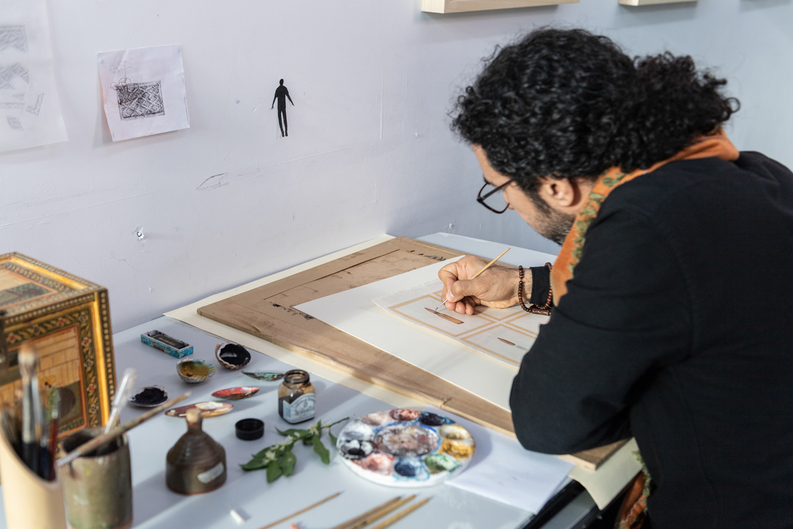 Artist Shorsh Saleh painting in his studio