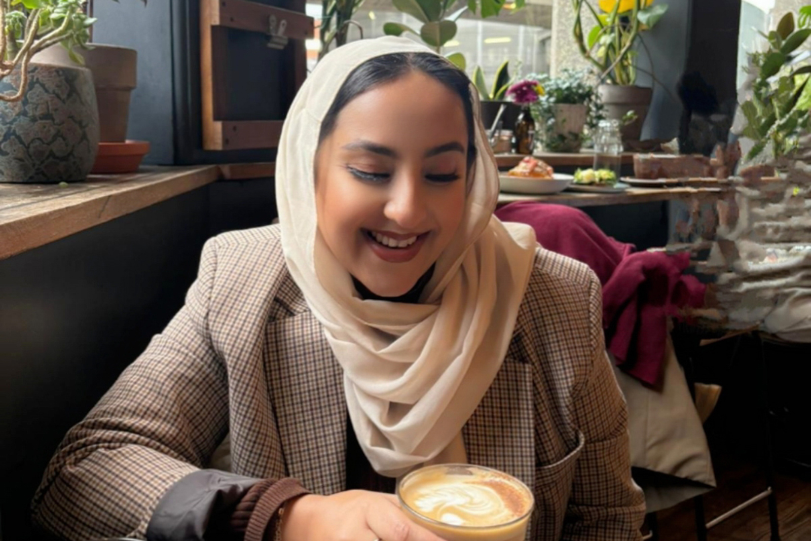 Fallaq Ujalla drinking coffee