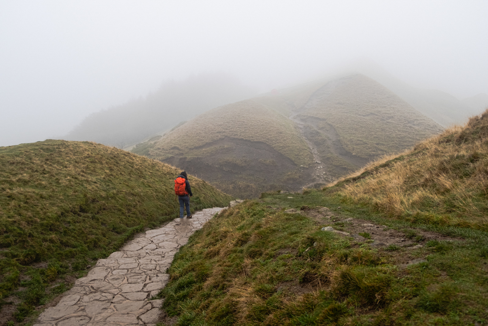 Freshta Ibrahimi descending Mam Tor, in the Peak District, Derbyshire.